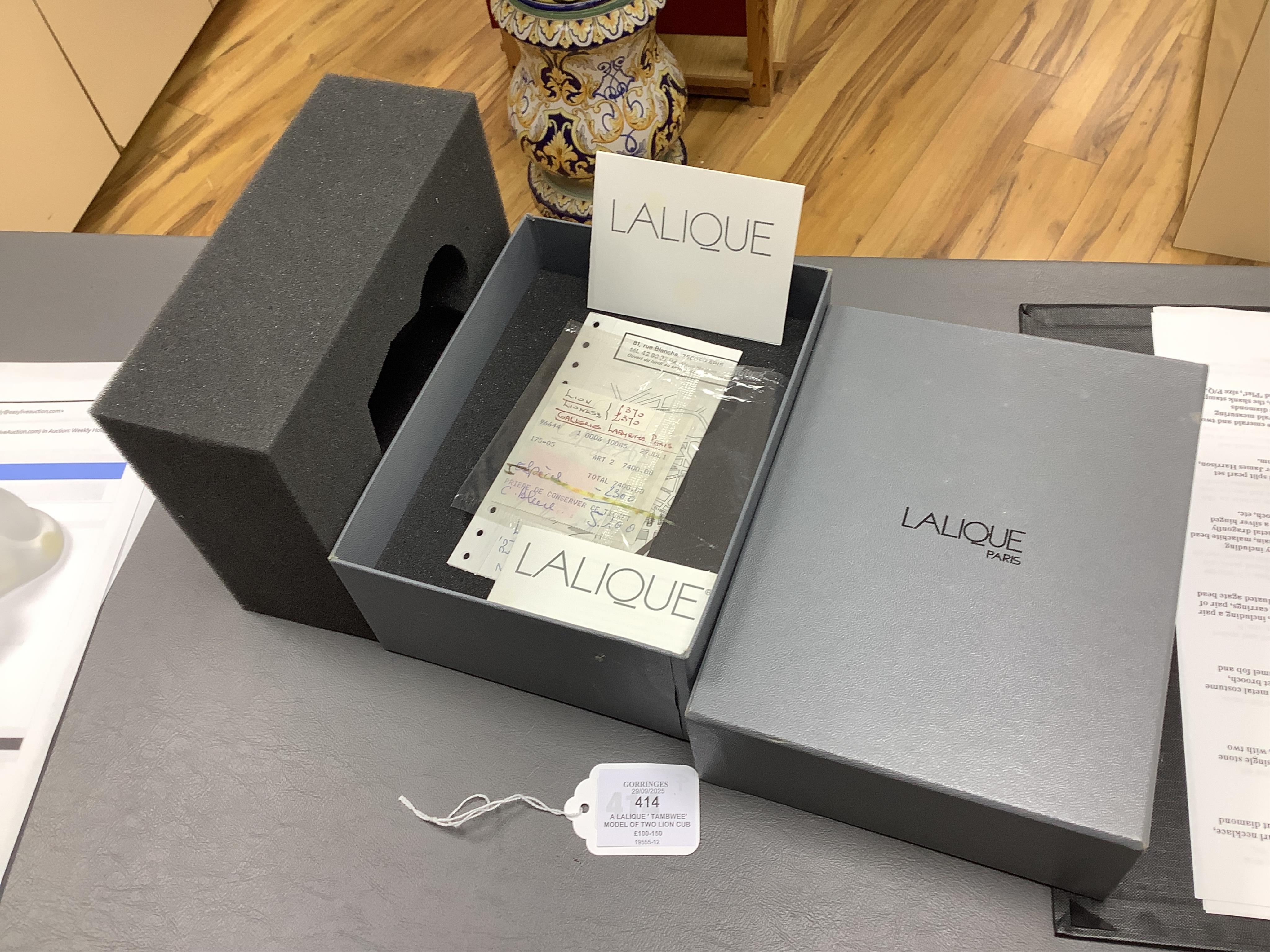 A Lalique ‘ Tambwee’ model of two lion cubs (boxed), 12cm wide